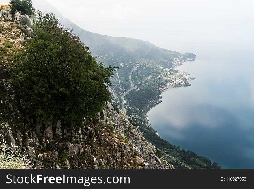 Scenic View Of Mountain Side Near Sea