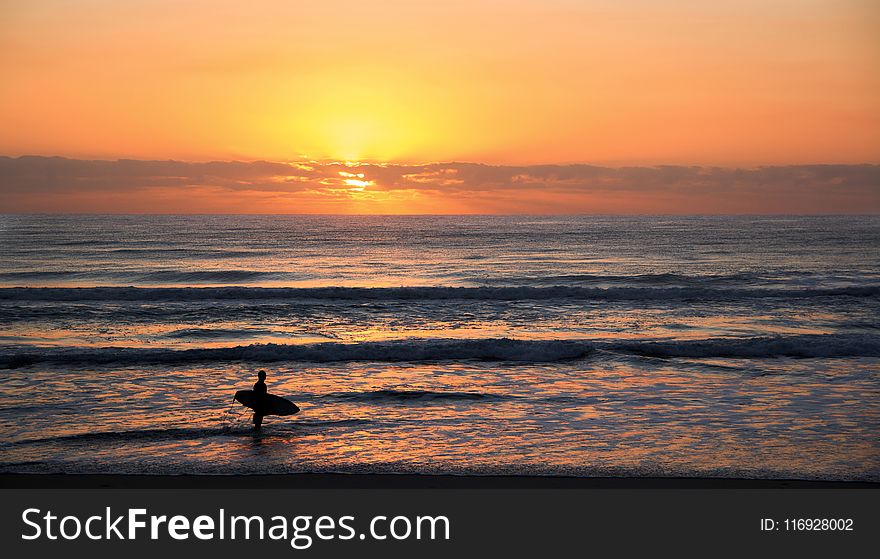 Photo of Surfer in Rule of Thirds Photography during Sunset