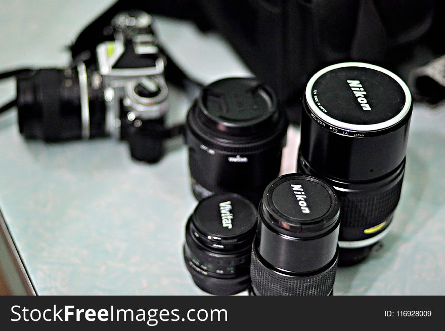 Four Black Nikon Zoom Camera Lens