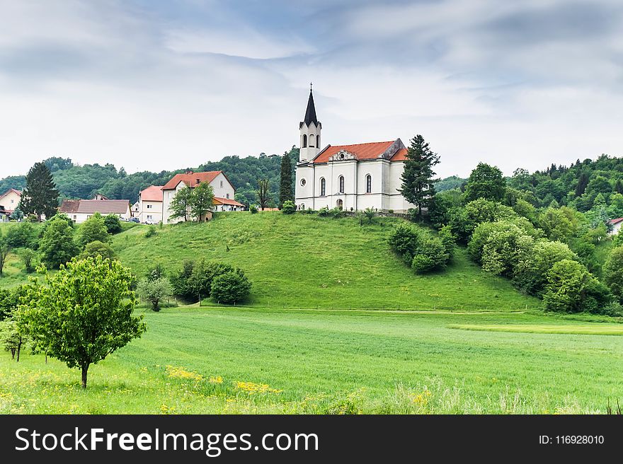 White And Red Concrete House Under White Sky