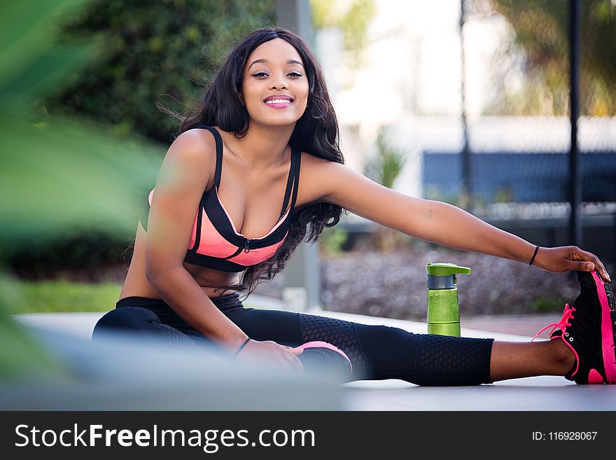 Woman Doing Leg Stretching While Sitting