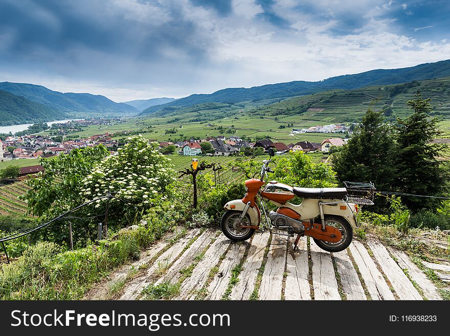 Old motorcycle on Wachau valley background. Lower Austria.