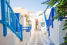 The Narrow Streets Of The Island With Blue Balconies, Stairs And Flowers. Stock Image