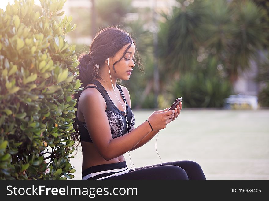 Woman In Black Crop Top Holding Smartphone