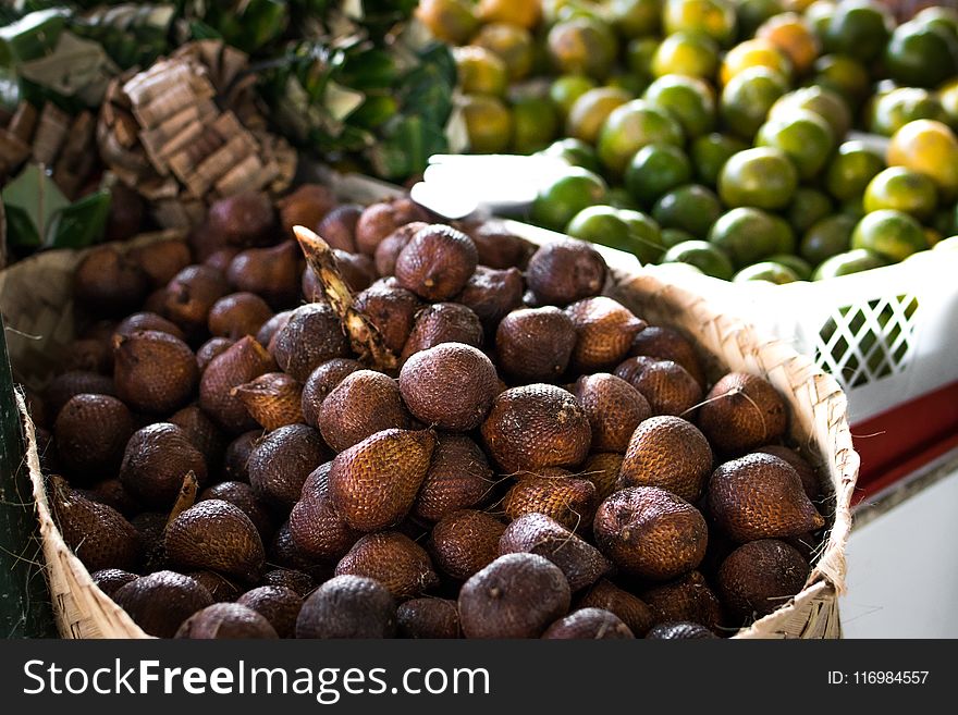 Pile of Brown Fruit With Brown Basket
