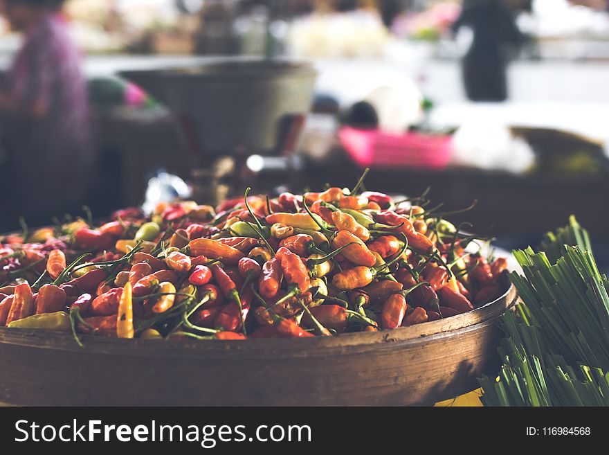 Focus Photo of Round Brown Wooden Bowl Filled With Chili Lot