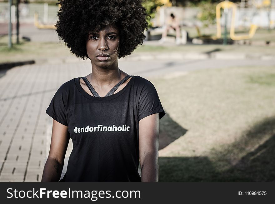 Woman Wearing Black T-shirt Standing Near Playground