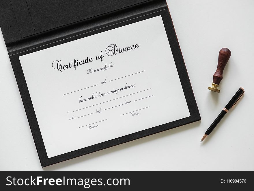 Certificate of Divorce Paper Beside Black Ballpoint Pen