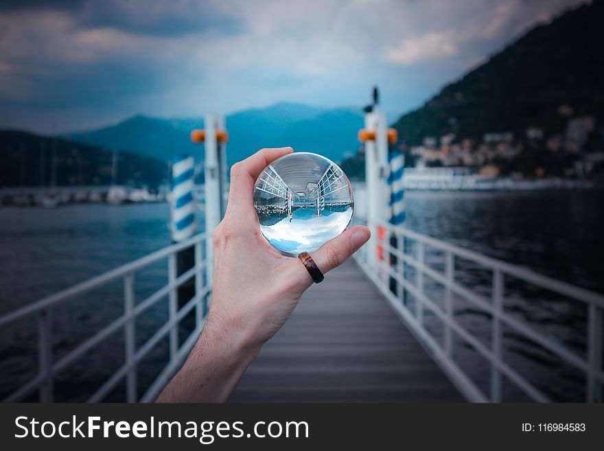Person Holding Clear Glass