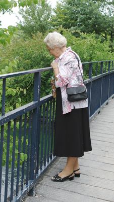 Free Senior Lady Looking Into River Royalty Free Stock Photo - 1174625