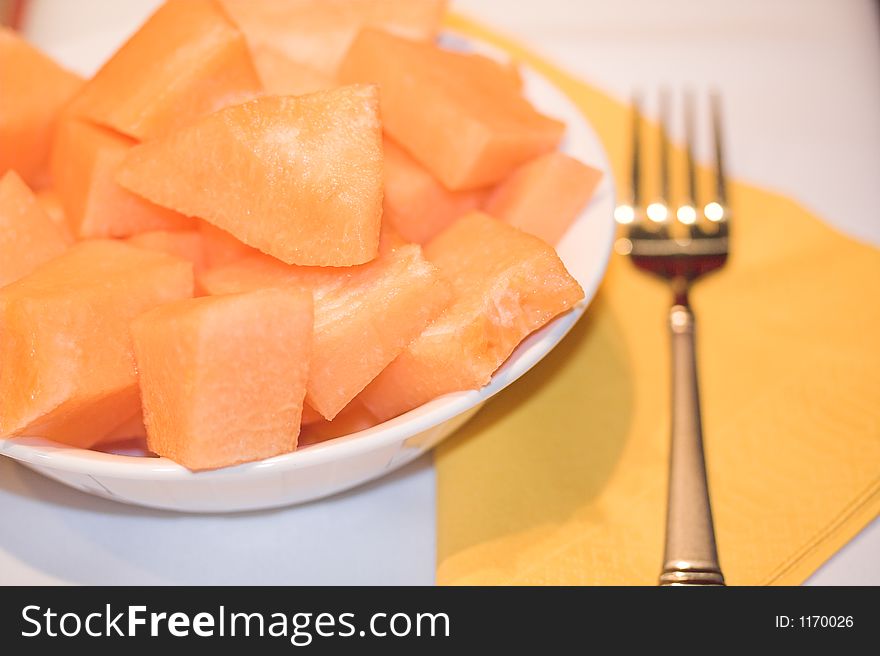 Fresh ripe melons in white ceramic bowl. Fresh ripe melons in white ceramic bowl