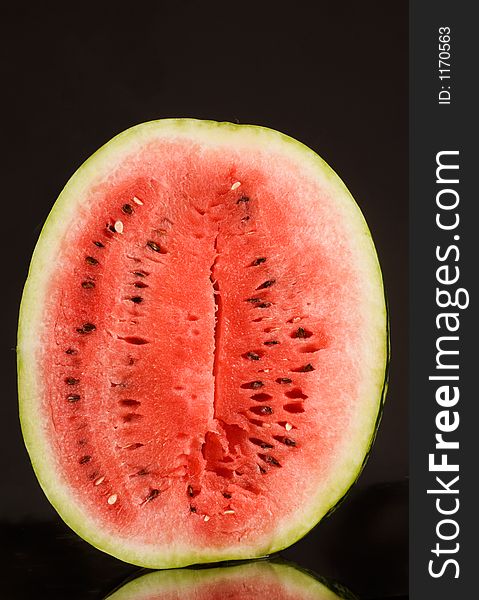 Red tasty watermelon over black