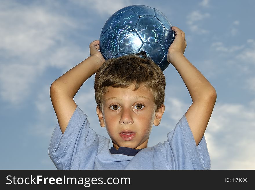 Photo of a Child Holding a Soccer Ball. Photo of a Child Holding a Soccer Ball
