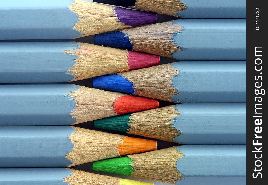 Coloured pencils in metal box, used for watercolour pictures on canvas or paper. Very close macro shot. Coloured pencils in metal box, used for watercolour pictures on canvas or paper. Very close macro shot