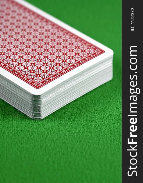 Close-up of a deck of cards on a card table