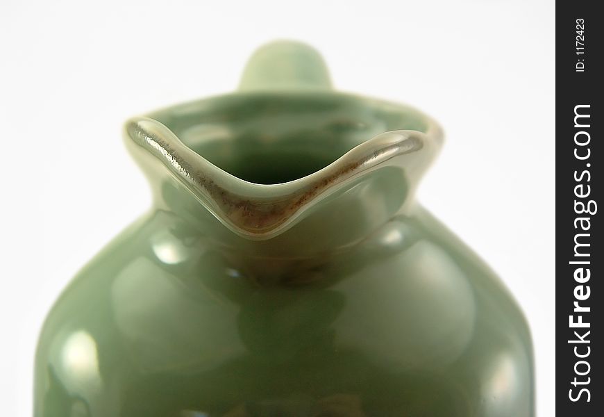 The spout of a green jug