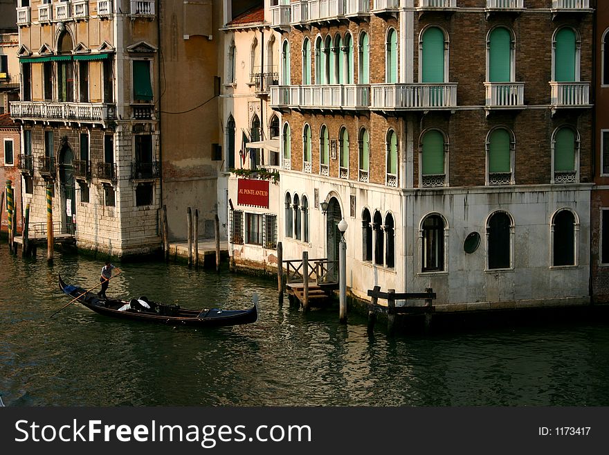 Gondola in a canal in venice
