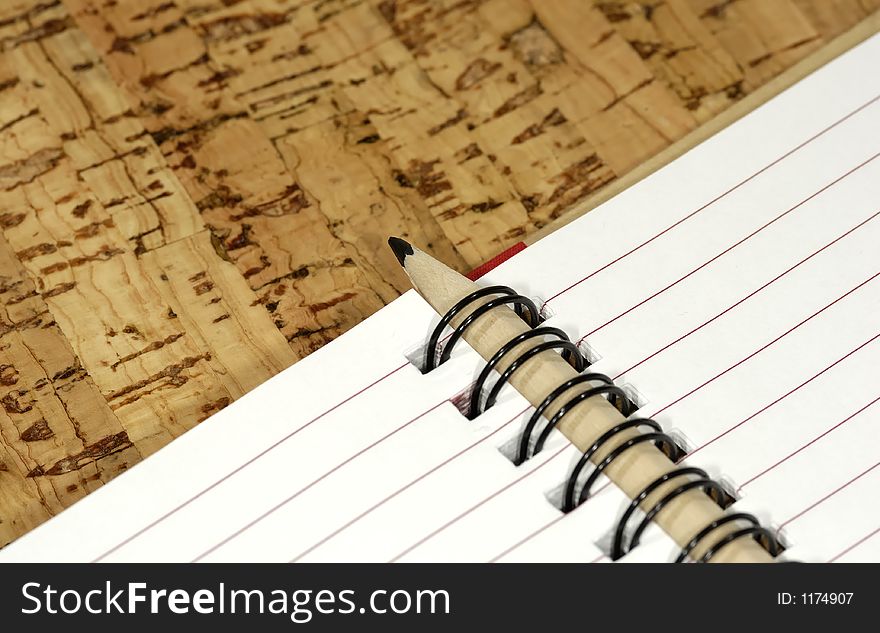 Photo of a Open Notebook with a Wooden Pencl. Photo of a Open Notebook with a Wooden Pencl