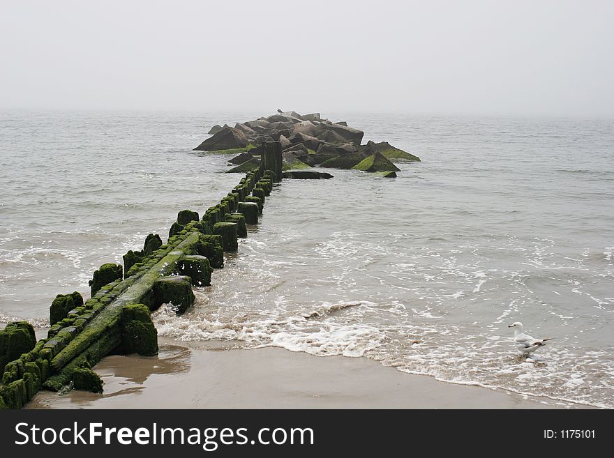 Lonely pier jutting out into ocean