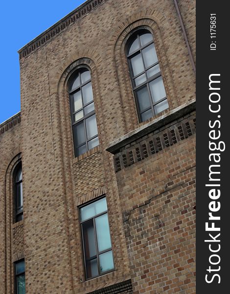 Old brick building against a blue sky