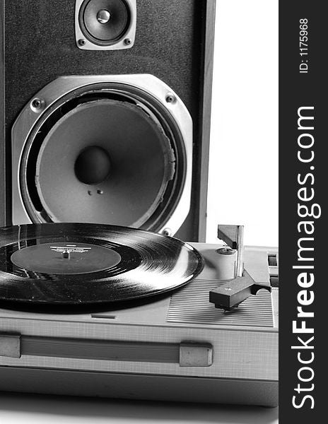 Black and white image of an old speaker and record player