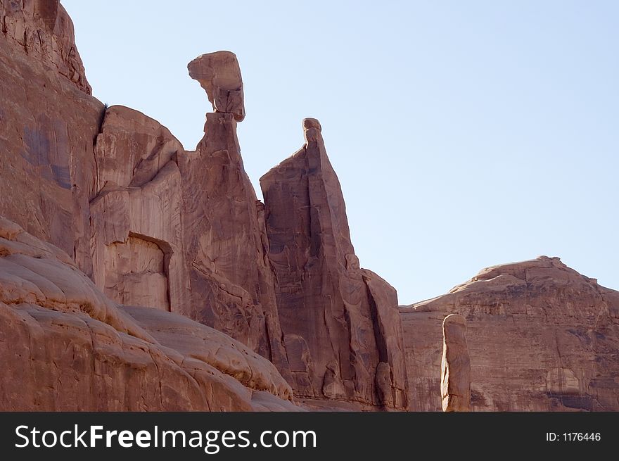 The Gossips, natural rock monument looking like an Egyptian head  in Arches National Park, Utah, USA. The Gossips, natural rock monument looking like an Egyptian head  in Arches National Park, Utah, USA