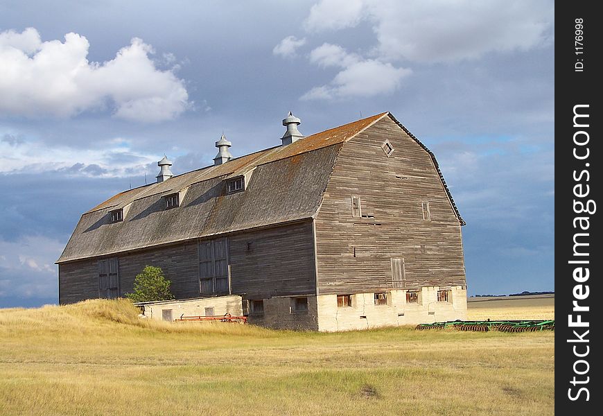 Grand old barn against a prairie sky.