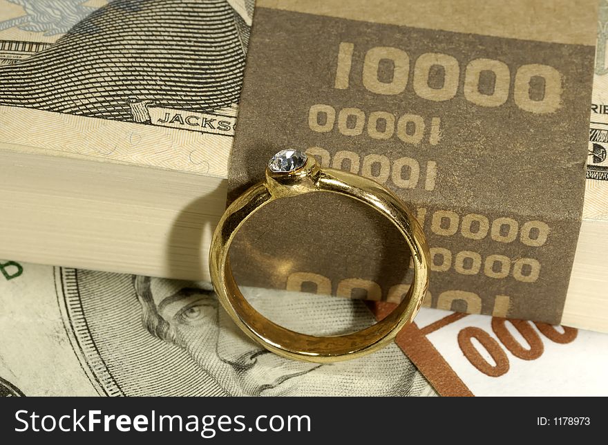 Diamond Engagement Ring on Money - Wedding Expense Concept. Diamond Engagement Ring on Money - Wedding Expense Concept