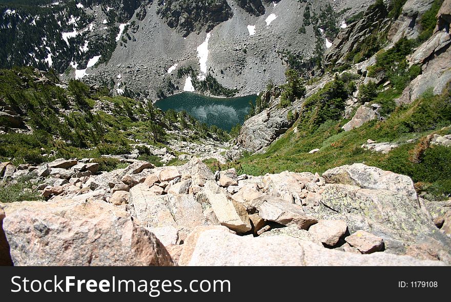 Downhill veiw of a lake on a windy day.