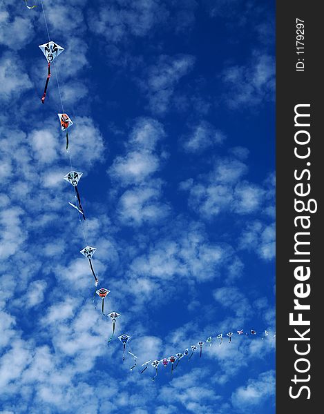 Flying kites under summer blue sky