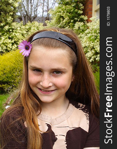 Beautiful young girl with flower in hair. Beautiful young girl with flower in hair