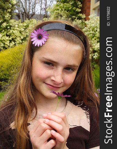 Beautiful young girl with flower in hair. Beautiful young girl with flower in hair