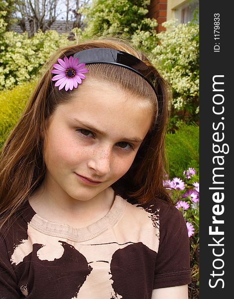 Beautiful young girl with flower in hair. Beautiful young girl with flower in hair