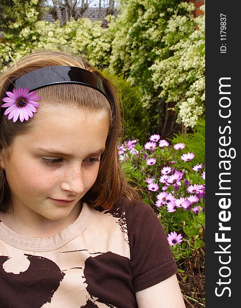 Beautiful young girl with flower in hair. Beautiful young girl with flower in hair