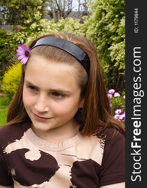 Beautiful young girl with flower in hair. Beautiful young girl with flower in hair
