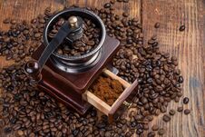 Coffee Mill On Rustic Wooden Plank Background And Roasted Coffee Beans Stock Photography Coffee Mill On Rustic Wooden Plank Background And Roasted Coffee Beans Stock Photography