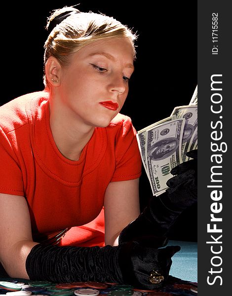 Blond girl holding large sum of dollar cash. Blond girl holding large sum of dollar cash