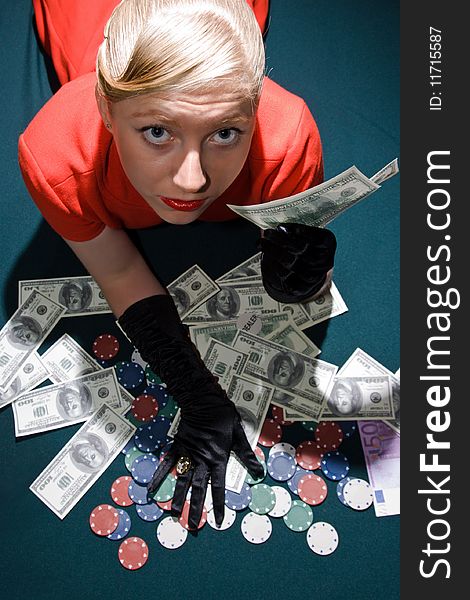 Blond girl holding a large sum of dollar cash. Blond girl holding a large sum of dollar cash