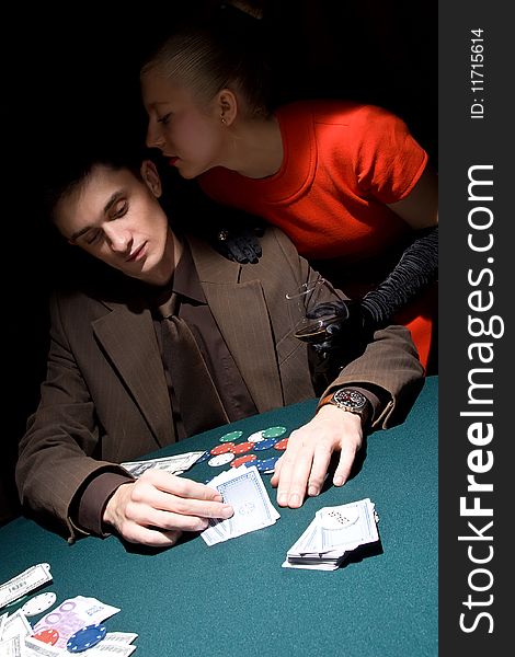 Couple of young gamblers at the poker table. Couple of young gamblers at the poker table