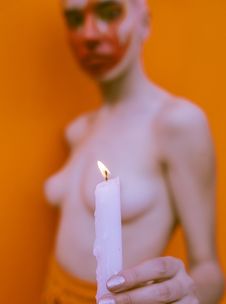 Free Shallow Focus Photography Of Topless Woman Holding White Candle Stock Images - 117112434