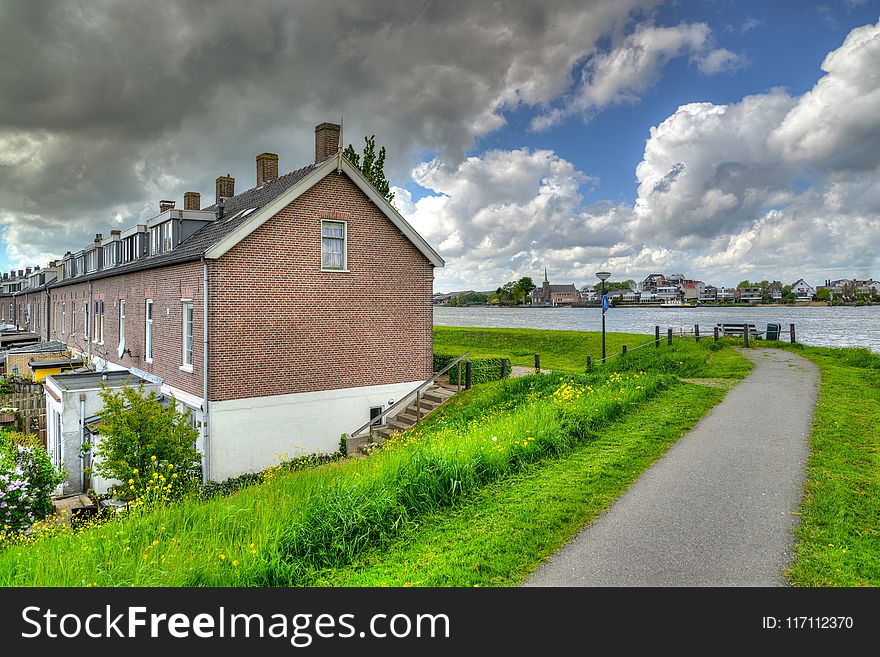 Brown House Near Body of Water