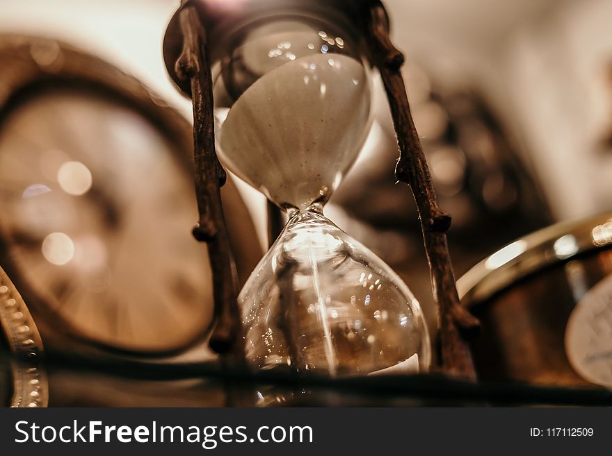 Shallow Focus Photography of Hourglass