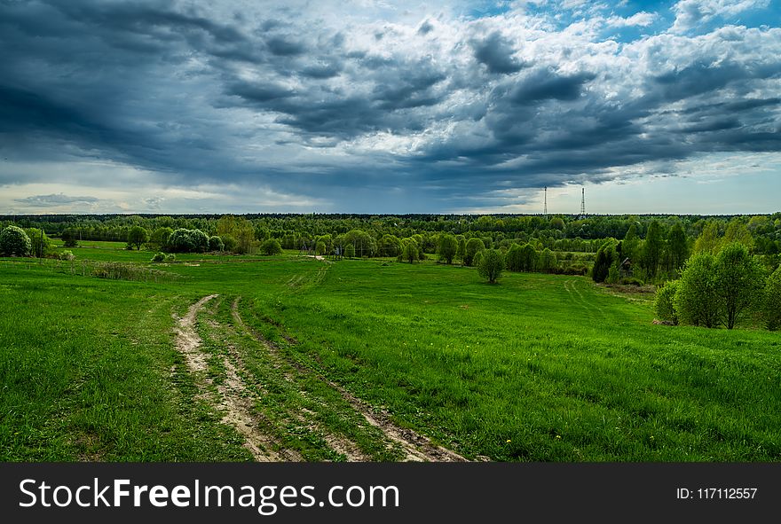 Gray Clouds Under Green Field