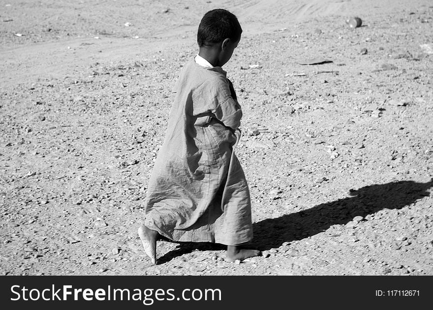 Photographed Grayscale of Child in Dress