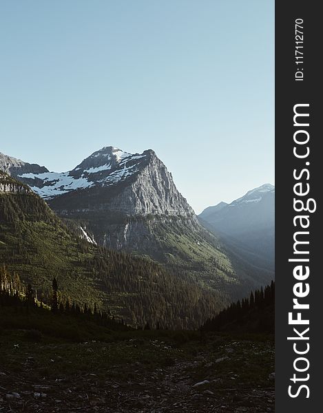 Green and Gray Mountain Under Blue Sky