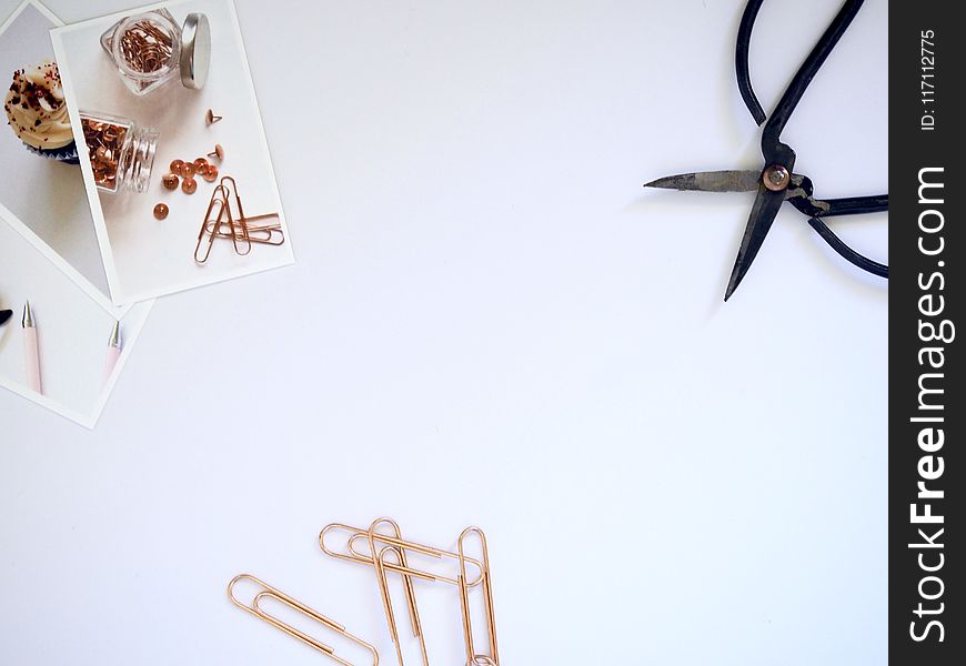 Flat Lay Photography of Paper Clips and Scissor