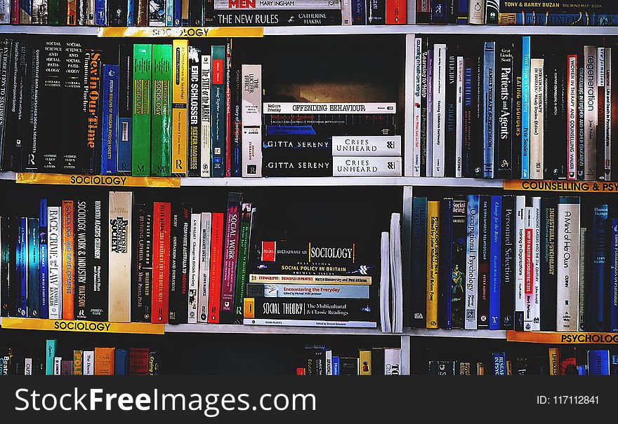 Photography of Books on Bookshelf
