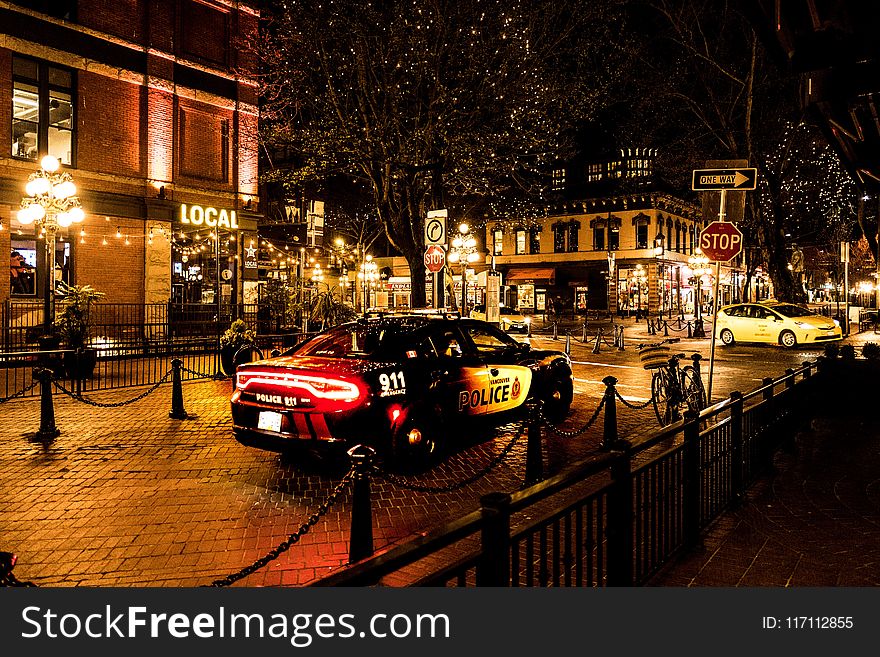 Photography of Police Car During Night Time