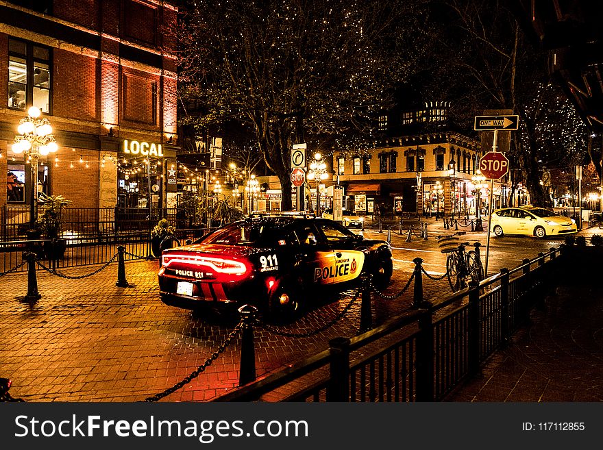 Photography Of Police Car During Night Time