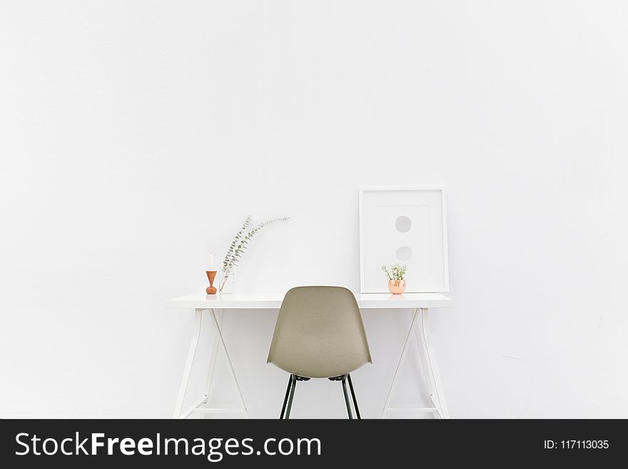 Beige and Black Chair in Front of White Desk